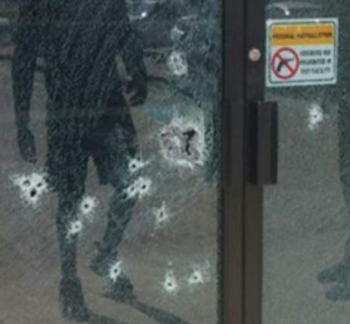 How can there be bullet holes in that glass when the sign clearly says that this is a gun-free zone?